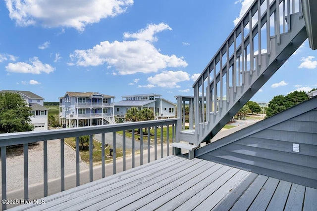 308 N Shore Dr E, Sunset Beach, NC 28468 - wooden terrace with stairs and a residential view