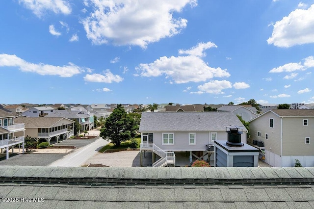 308 N Shore Dr E, Sunset Beach, NC 28468 - rear view of property featuring a residential view and stairway