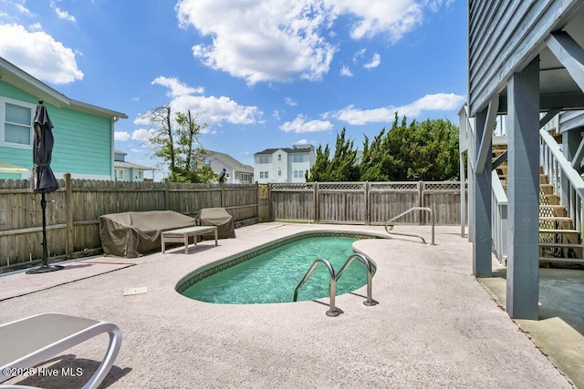 308 N Shore Dr E, Sunset Beach, NC 28468 - view of pool featuring a patio area, stairway, and a fenced backyard