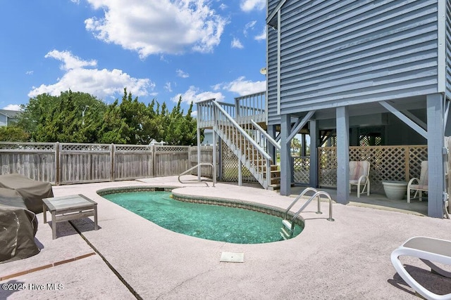 308 N Shore Dr E, Sunset Beach, NC 28468 - view of swimming pool featuring a patio, stairway, and a deck