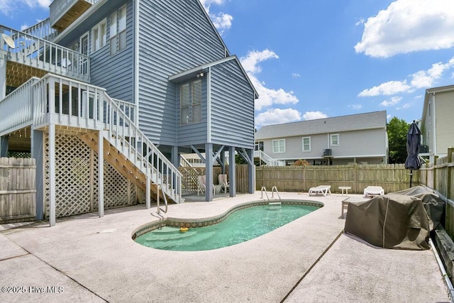 308 N Shore Dr E, Sunset Beach, NC 28468 - view of pool with a patio area, a fenced backyard, and stairway