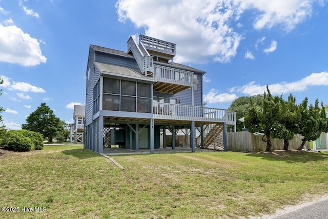 308 N Shore Dr E, Sunset Beach, NC 28468 - rear view of property with stairs, a sunroom, a deck, roof with shingles, and a carport