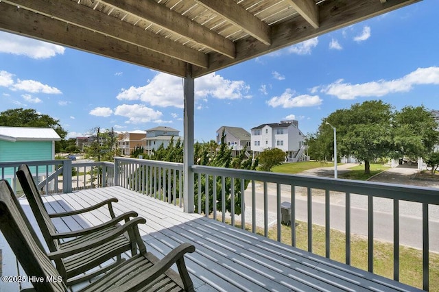 308 N Shore Dr E, Sunset Beach, NC 28468 - wooden terrace featuring a residential view