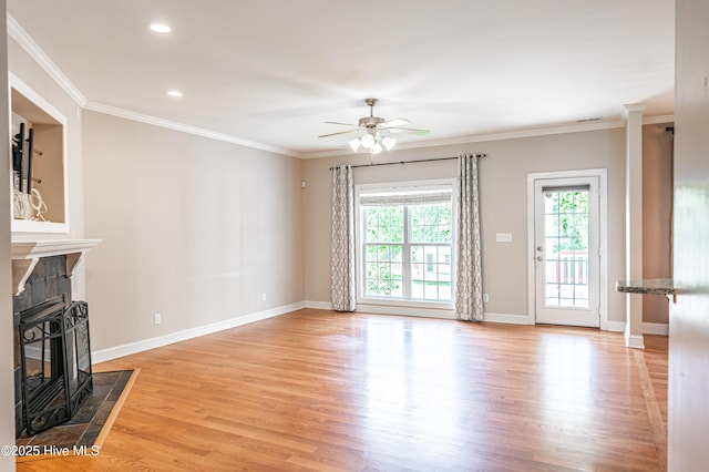 600 Booth Pond Rd, Raeford, NC 28376 - unfurnished living room featuring light wood-style floors, ceiling fan, a fireplace, ornamental molding, and baseboards
