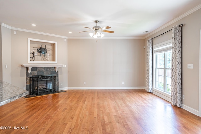 600 Booth Pond Rd, Raeford, NC 28376 - unfurnished living room with light wood finished floors, a ceiling fan, crown molding, baseboards, and a stone fireplace