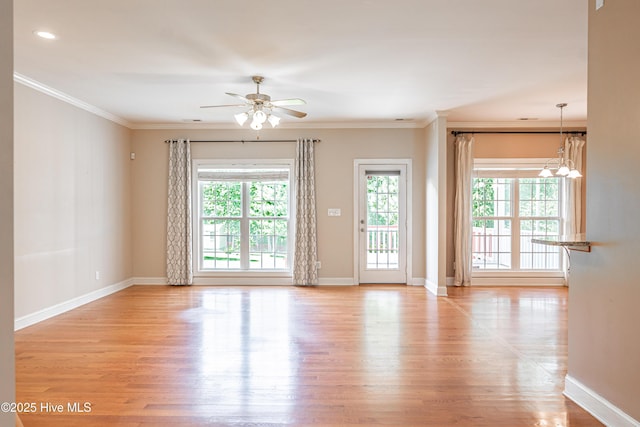 600 Booth Pond Rd, Raeford, NC 28376 - spare room with light wood finished floors, a ceiling fan, ornamental molding, baseboards, and a chandelier