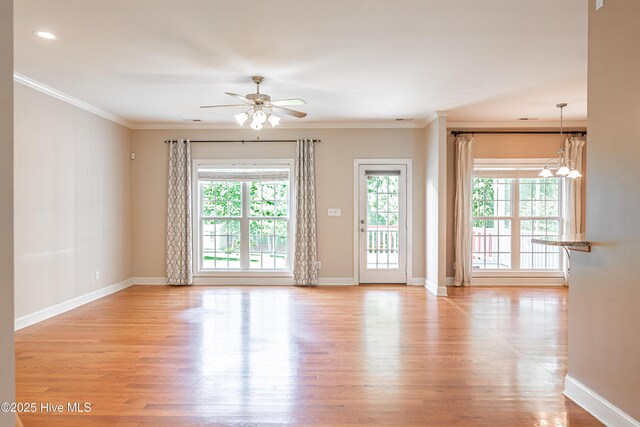 600 Booth Pond Rd, Raeford, NC 28376 - spare room with light wood finished floors, a ceiling fan, ornamental molding, baseboards, and a chandelier