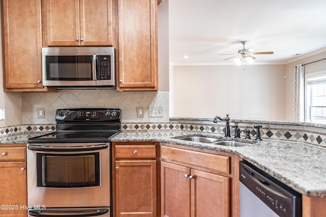 600 Booth Pond Rd, Raeford, NC 28376 - kitchen featuring appliances with stainless steel finishes, a sink, ornamental molding, ceiling fan, and decorative backsplash