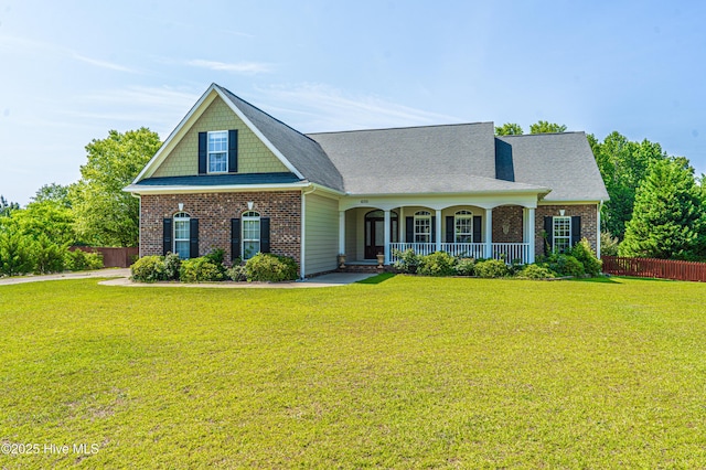 600 Booth Pond Rd, Raeford, NC 28376 - view of front of property featuring a porch, brick siding, and roof with shingles
