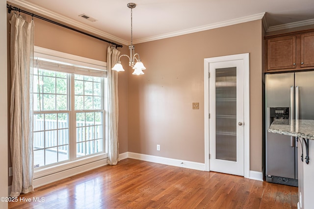600 Booth Pond Rd, Raeford, NC 28376 - unfurnished dining area featuring baseboards, light wood finished floors, healthy amount of natural light, and ornamental molding