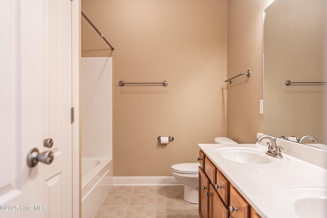 600 Booth Pond Rd, Raeford, NC 28376 - full bathroom with double vanity, toilet, baseboards, tile patterned flooring, and  shower combination