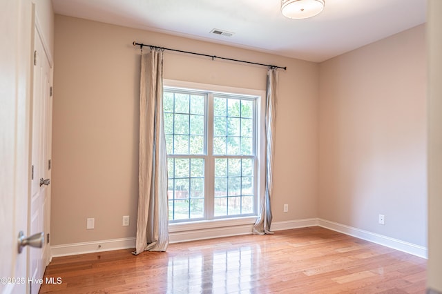 600 Booth Pond Rd, Raeford, NC 28376 - unfurnished room with plenty of natural light, light wood-style flooring, and baseboards