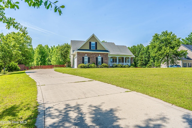 600 Booth Pond Rd, Raeford, NC 28376 - view of front of property featuring concrete driveway and brick siding
