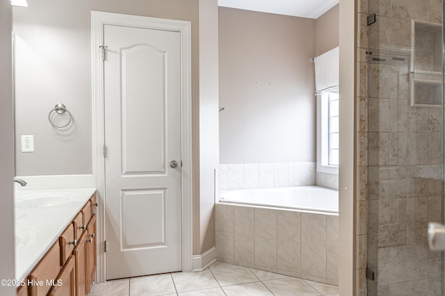 600 Booth Pond Rd, Raeford, NC 28376 - bathroom featuring double vanity, a bath, a stall shower, and tile patterned floors