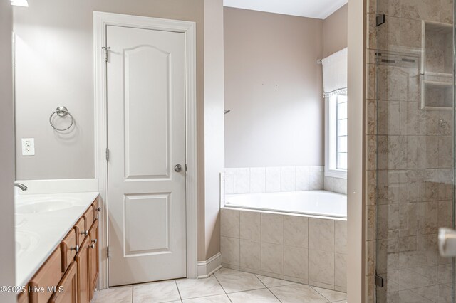 600 Booth Pond Rd, Raeford, NC 28376 - bathroom featuring double vanity, a bath, a stall shower, and tile patterned floors