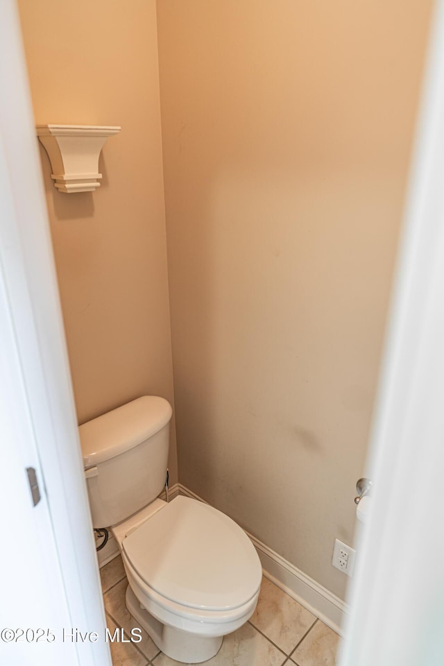 600 Booth Pond Rd, Raeford, NC 28376 - bathroom with toilet, tile patterned flooring, and baseboards
