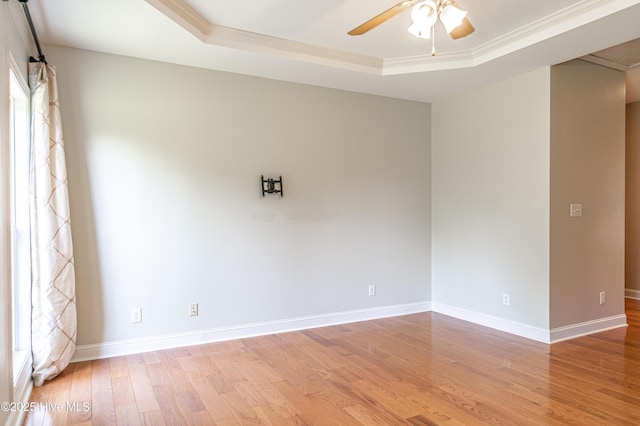 600 Booth Pond Rd, Raeford, NC 28376 - unfurnished room with a tray ceiling, a ceiling fan, light wood finished floors, baseboards, and crown molding