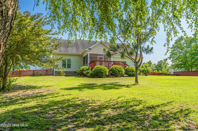 600 Booth Pond Rd, Raeford, NC 28376 - rear view of property featuring a deck, crawl space, a sunroom, and roof with shingles