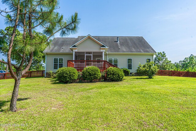 600 Booth Pond Rd, Raeford, NC 28376 - back of property featuring a sunroom and roof with shingles