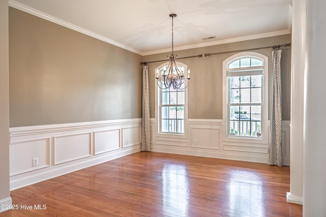 600 Booth Pond Rd, Raeford, NC 28376 - unfurnished room with a chandelier, wood finished floors, a wainscoted wall, and ornamental molding