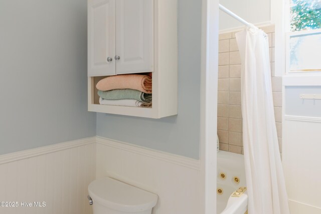 1498 Bayview Rd, Bath, NC 27808 - full bath with a wainscoted wall, toilet, and a combined bath / shower with jetted tub