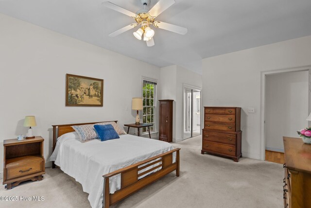 6304 Wolfhead Ct, Wilmington, NC 28411 - bedroom with light carpet, ceiling fan, baseboards, and ensuite bath