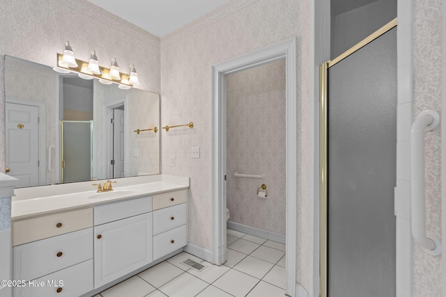 6304 Wolfhead Ct, Wilmington, NC 28411 - full bath featuring tile patterned floors, vanity, a stall shower, and toilet