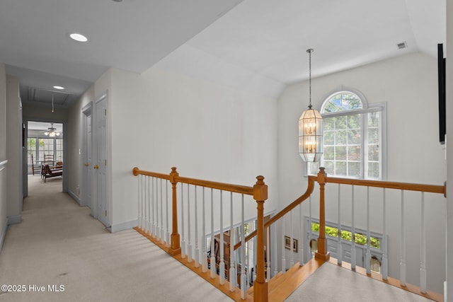 6304 Wolfhead Ct, Wilmington, NC 28411 - hall with an upstairs landing, attic access, carpet, vaulted ceiling, and baseboards