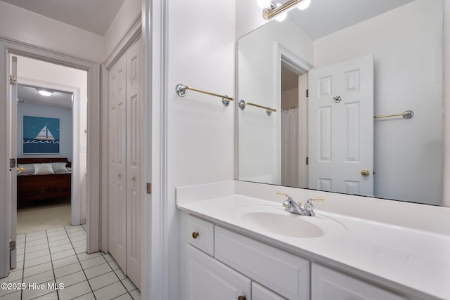 6304 Wolfhead Ct, Wilmington, NC 28411 - bathroom with vanity, tile patterned floors, and a closet