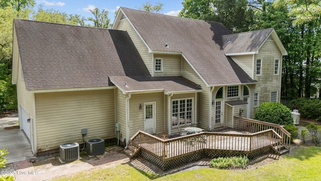 6304 Wolfhead Ct, Wilmington, NC 28411 - back of house featuring a deck, a shingled roof, and central AC unit