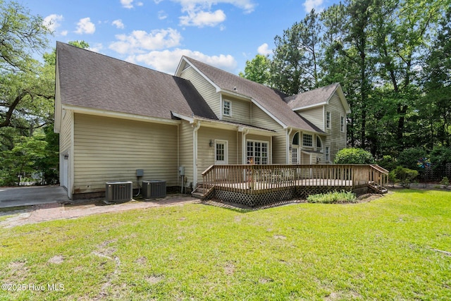 6304 Wolfhead Ct, Wilmington, NC 28411 - rear view of property with a wooden deck, a lawn, central air condition unit, and a shingled roof