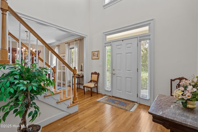 6304 Wolfhead Ct, Wilmington, NC 28411 - entrance foyer featuring stairs, light wood-type flooring, and baseboards