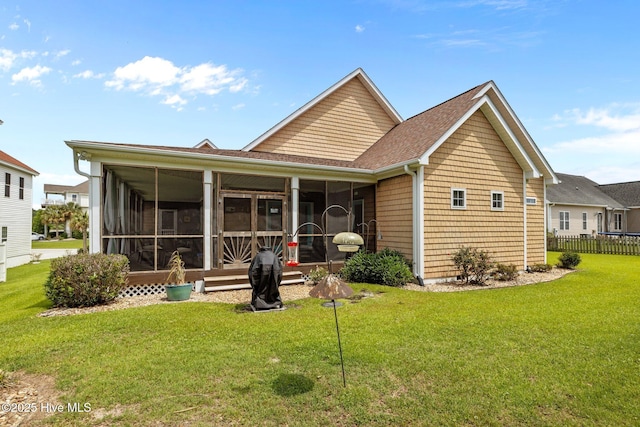 211 Tidewater Dr, Newport, NC 28570 - rear view of property with a sunroom and a shingled roof