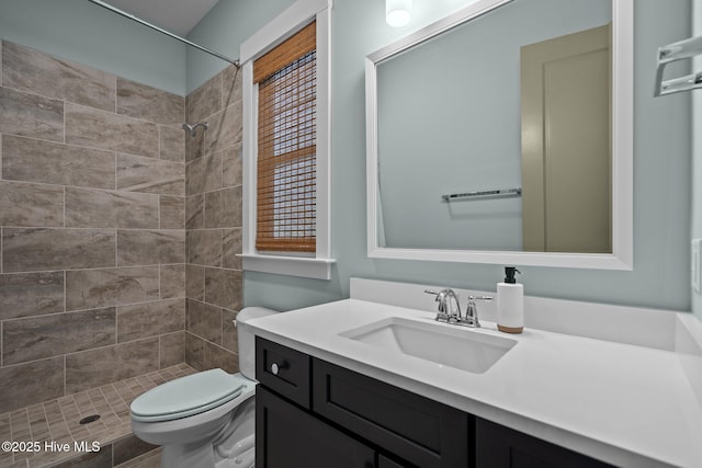 633 Ashbury Dr SE, Bolivia, NC 28422 - bathroom with vanity, a tile shower, and toilet