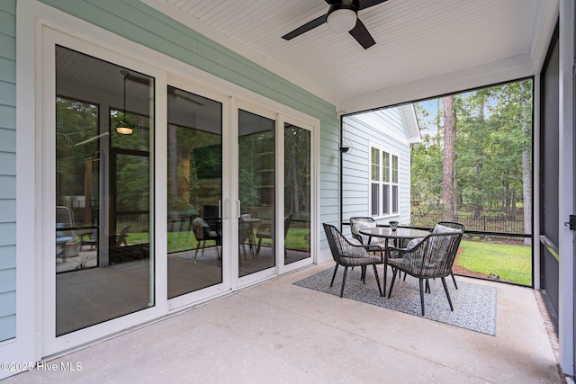 633 Ashbury Dr SE, Bolivia, NC 28422 - sunroom with ceiling fan and outdoor dining space