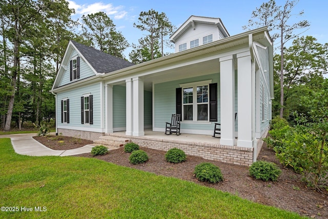 633 Ashbury Dr SE, Bolivia, NC 28422 - view of front of property with covered porch and a front lawn