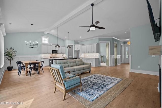 633 Ashbury Dr SE, Bolivia, NC 28422 - living area featuring light wood-style floors, ceiling fan, and a chandelier