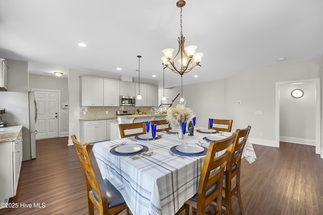 14 Allbrook Way, Hampstead, NC 28443 - dining space featuring a chandelier, dark wood-style floors, baseboards, and recessed lighting