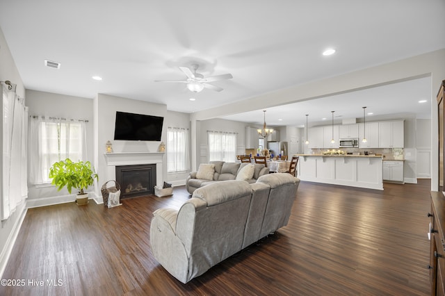 14 Allbrook Way, Hampstead, NC 28443 - living room with dark wood finished floors, ceiling fan, healthy amount of natural light, recessed lighting, and a glass covered fireplace