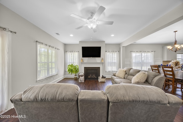 14 Allbrook Way, Hampstead, NC 28443 - living area with a chandelier, ceiling fan, dark wood finished floors, a glass covered fireplace, and baseboards