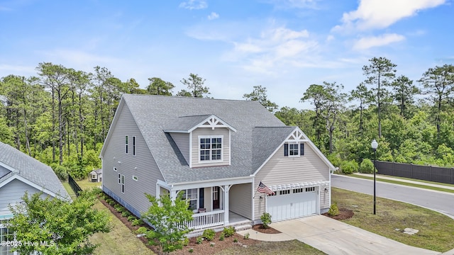 14 Allbrook Way, Hampstead, NC 28443 - view of front of home with a porch, concrete driveway, and roof with shingles