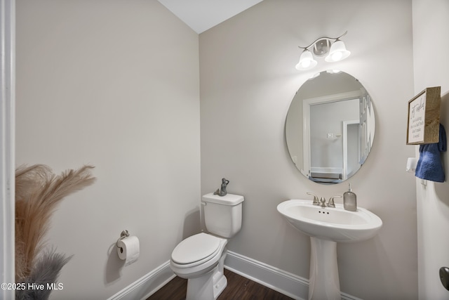 14 Allbrook Way, Hampstead, NC 28443 - bathroom with wood finished floors, baseboards, toilet, and a sink