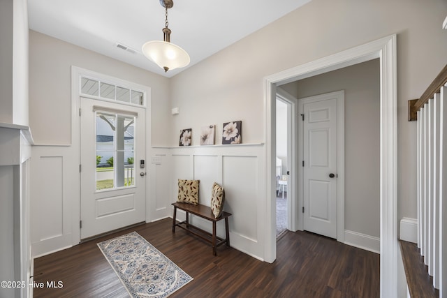 14 Allbrook Way, Hampstead, NC 28443 - entrance foyer with dark wood-style flooring, wainscoting, and a decorative wall