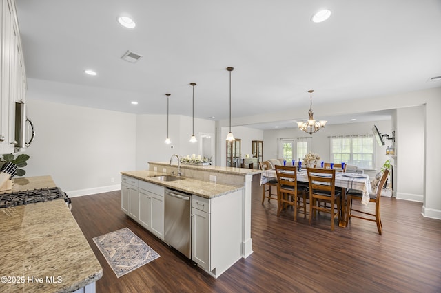14 Allbrook Way, Hampstead, NC 28443 - kitchen featuring stainless steel appliances, a sink, dark wood-type flooring, a kitchen island with sink, and baseboards
