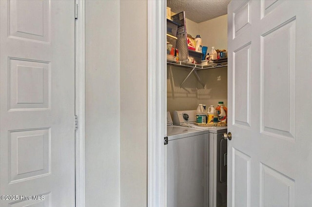 816 Colony Pl Unit D, Sunset Beach, NC 28468 - washroom with washing machine and dryer and a textured ceiling