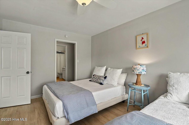 816 Colony Pl Unit D, Sunset Beach, NC 28468 - bedroom with wood finished floors and a ceiling fan