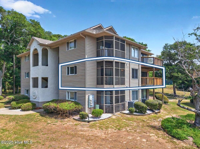 816 Colony Pl Unit D, Sunset Beach, NC 28468 - view of side of home featuring a balcony and a sunroom