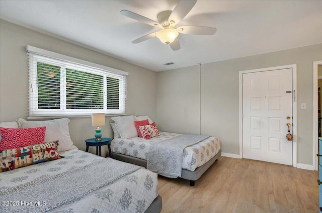 816 Colony Pl Unit D, Sunset Beach, NC 28468 - bedroom featuring light wood-type flooring, baseboards, and ceiling fan
