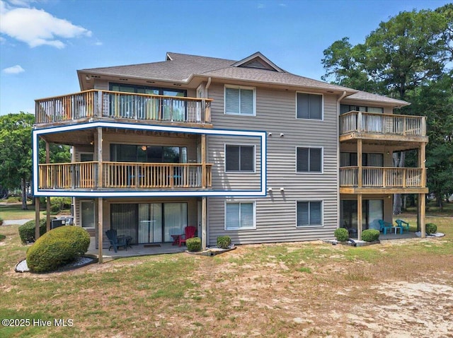 816 Colony Pl Unit D, Sunset Beach, NC 28468 - rear view of property with a balcony and a patio
