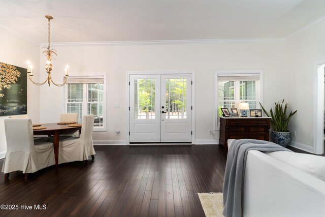 10 Linville Dr, Pinehurst, NC 28374 - dining room featuring a chandelier, ornamental molding, french doors, dark wood-style flooring, and baseboards